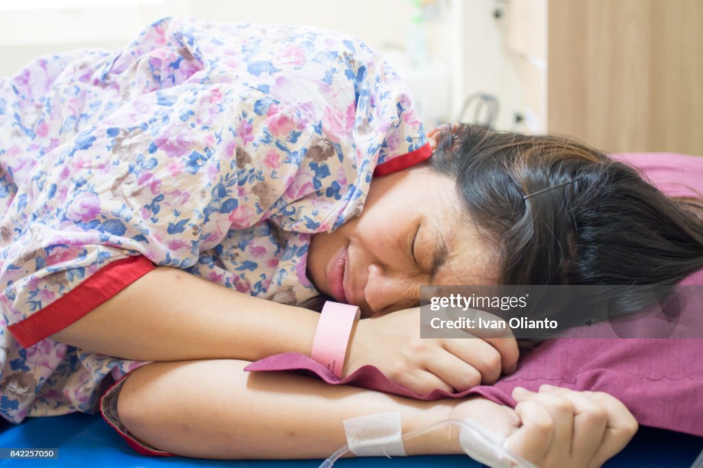 Asian Woman Giving Birth