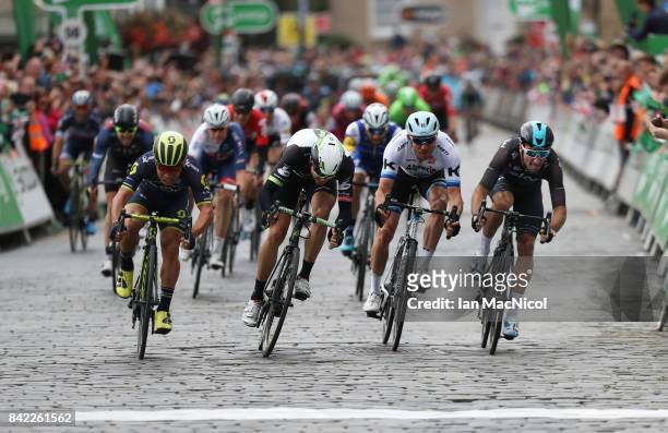 Caleb Ewen of Team Orica Scott wins a sprint finish from Edvald Boasson-Hagen, Alexander Kristoff and Elia Viviani on stage one during the 14th Tour...