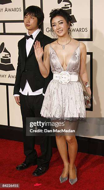 Korean singers Shin Seung Hun and Lee Soo Young arrive on the red carpet for The 50th Annual Grammy Awards held at the Staples Center on February 10,...