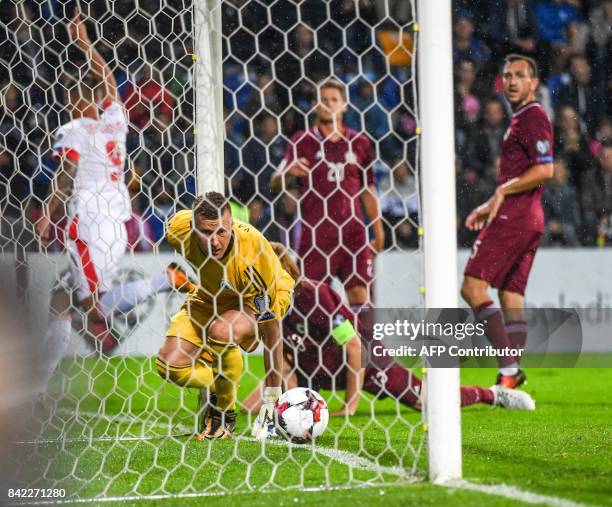 Latvia's goalkeeper Andris Vanins fails to make a save during the FIFA World Cup 2018 qualification football match between Latvia and Switzerland in...