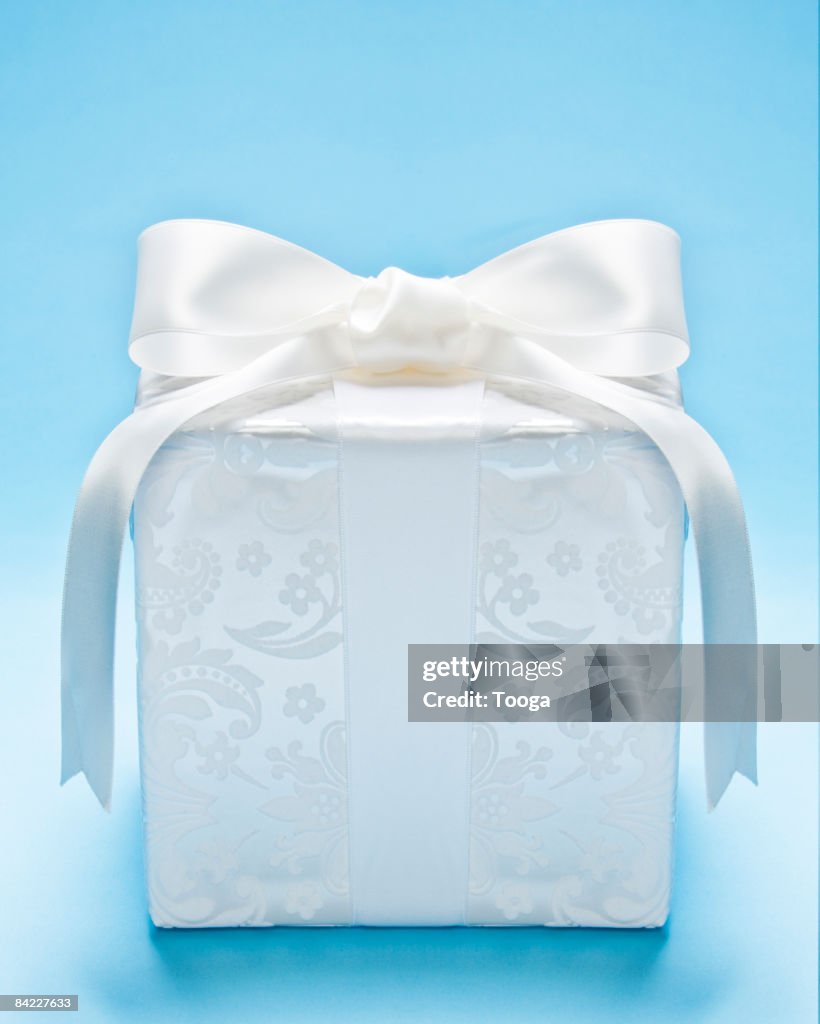 White Present On Blue Background High-Res Stock Photo - Getty Images