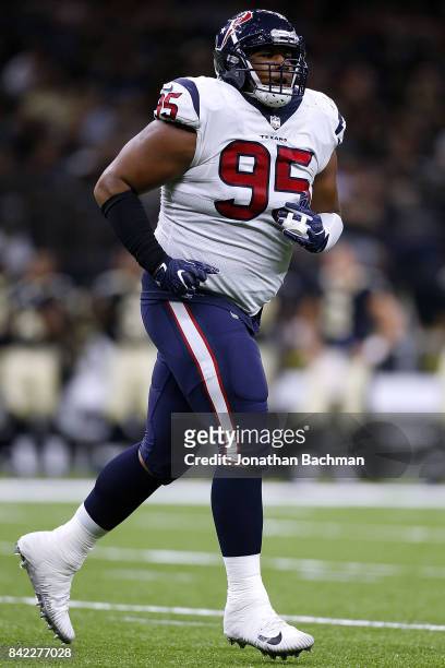 Christian Covington of the Houston Texans defends during the first half of a preseason game against the New Orleans Saints at the Mercedes-Benz...