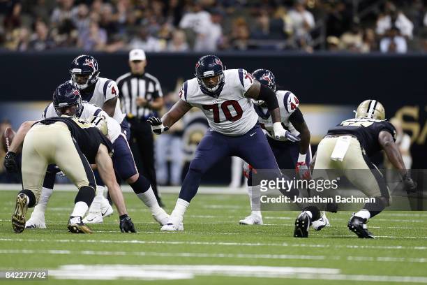 Julie'n Davenport of the Houston Texans blocks during the second half of a preseason game against the New Orleans Saints at the Mercedes-Benz...