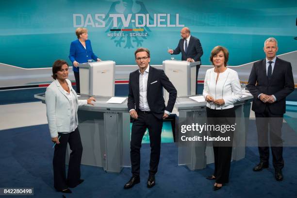 In this handout picture provided by German television channel ARD, German Chancellor and Christian Democrat Angela Merkel and German Social Democrat...