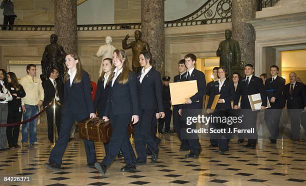 Jan. 08: A parade of pages -- carrying two heavy wooden boxes to the House chamber, each containing sealed envelopes of Electoral College votes for...