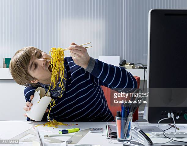 young office worker eating asian food - ruler desk stock pictures, royalty-free photos & images