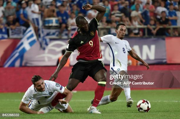 Belgium's Romelu Lukaku fights for the ball with Greece's Zeca and Konstantinos Manolas during their Group H 2018 FIFA World Cup qualifying football...