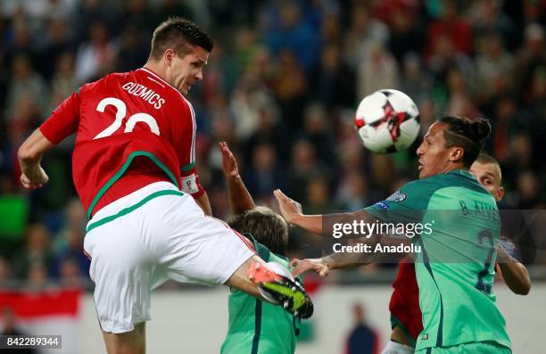 Portugal's Bruno Alves in action against Hungary's Richard Guzmics during the FIFA World Cup 2018 qualification football match between Hungary and...