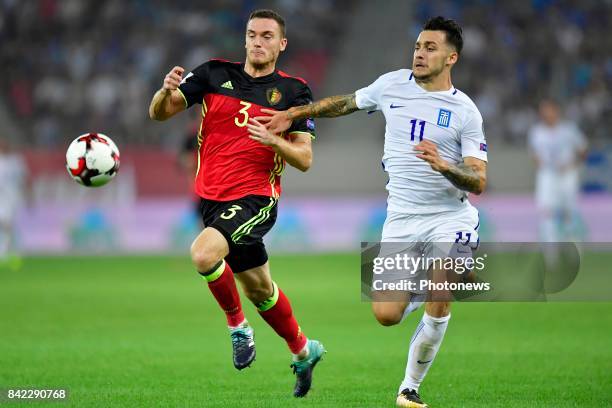 Tasos Donis forward of Greece is challenged by Thomas Vermaelen defender of Belgium during the World Cup Qualifier Group H match between Greece and...