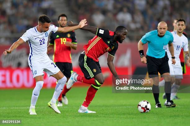 Romelu Lukaku forward of Belgium is challenged by Andreas Samaris midfielder of Greece during the World Cup Qualifier Group H match between Greece...