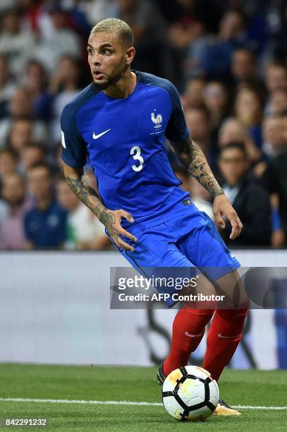 France's defender Layvin Kurzawa runs with the ball during the FIFA World Cup 2018 qualifying football match France vs Luxembourg on September 3,...