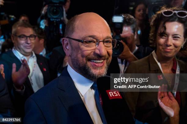 Martin Schulz, leader of Germany's social democratic SPD party and candidate for Chancellor, speaks to a journalist after a televised debate at a...