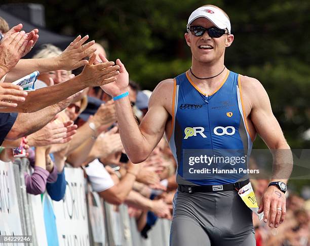 Duncan Milne of Taupo celebrates winning the men's division of the Port Of Tauranga Half Ironman at Mount Maunganui on January 10, 2009 in Tauranga,...