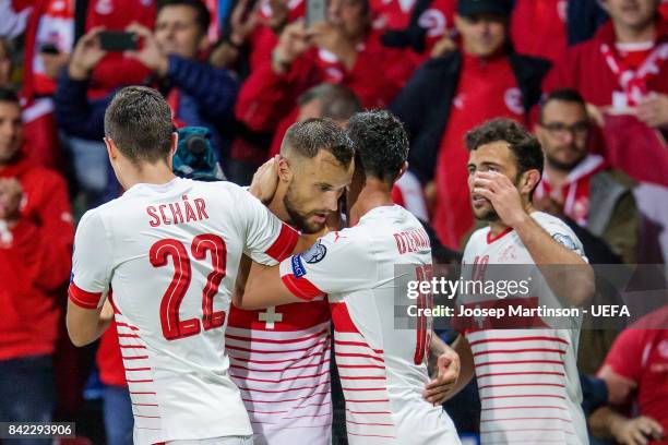 Blerim Dzemaili of Switzerland celebrates his goal with team mates during the FIFA 2018 World Cup Qualifier between Latvia and Switzerland at Skonto...