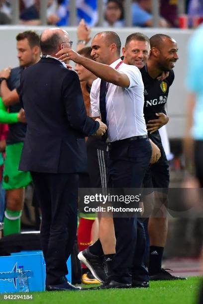 Roberto Martinez head coach of Belgian Team celebrates with Chris Van Puyvelde Technical Director of Royal Belgian Football Federation after winning...