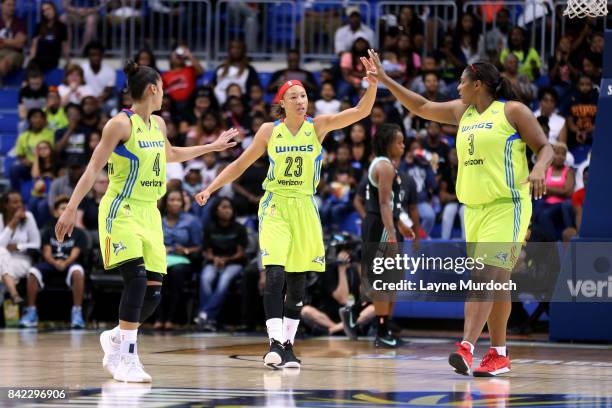 Aerial Powers of the Dallas Wings and Courtney Paris of the Dallas Wings high five each other during the game against the New York Liberty on...