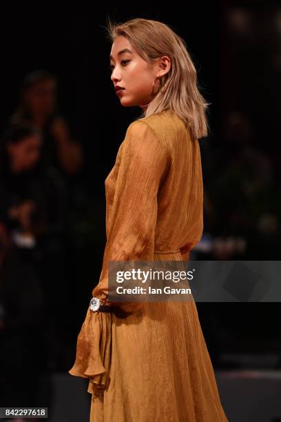 Margaret Zhang wearing a Jaeger-LeCoultre Rendez-Vous Moon watch walks the red carpet of the 'Victoria & Abdul' premiere and before The...