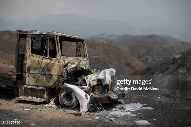 Burned truck is seen at the La Tuna Fire on September 3, 2017 near Burbank, California. At nearly 6,000 acres, the fire is the biggest fire in terms...