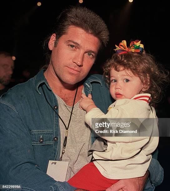 Singer/Songwriter Billy Ray Cyrus and daughter Miley Cyrus attends Elvis: The Tribute at The Pyramid Arena in Memphis Tennessee October 08, 1994