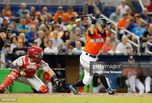 Ichiro Suzuki of the Miami Marlins pinch hitting before grounding out in the eighth inning in front of Jorge Alfaro of the Philadelphia Phillies at...