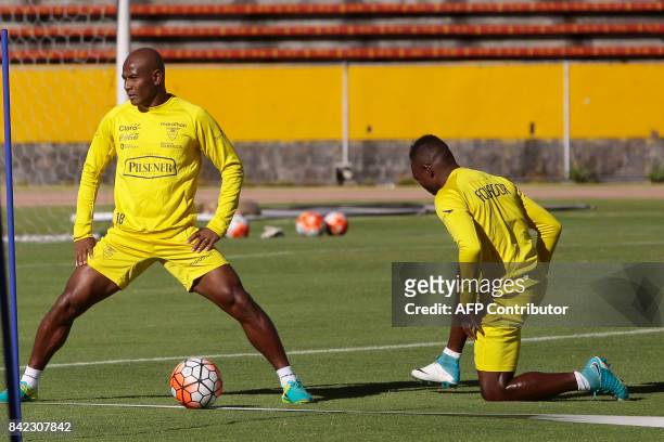 Ecuador's players Oscar Bagui and Walter Ayovi take part in a training session in the Olimpico Atahualpa stadium in Quito, Ecuador on September 3...