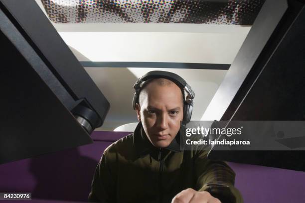 hispanic dj wearing headphones - dj portrait stock pictures, royalty-free photos & images