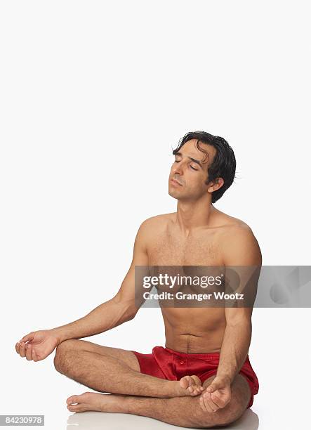 bare chested middle eastern man meditating - lotus position stock pictures, royalty-free photos & images