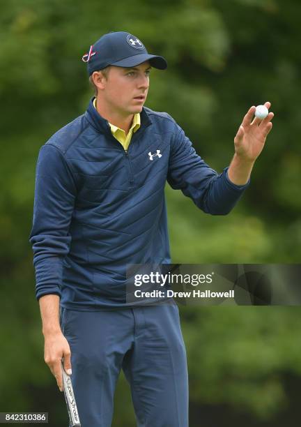 Jordan Spieth of the United States acknowledges the crowd after putting on the 18th green during round three of the Dell Technologies Championship at...