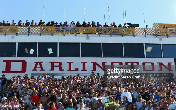 Fans look on prior to the start of the Monster Energy NASCAR Cup Series Bojangles' Southern 500 at Darlington Raceway on September 3, 2017 in...