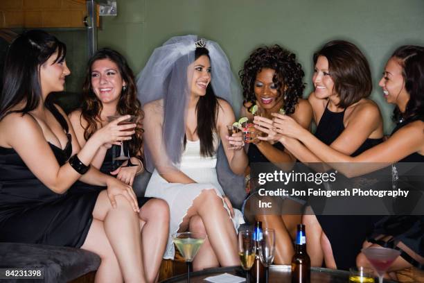 friends drinking cocktails with bride in nightclub - black veil brides stock pictures, royalty-free photos & images