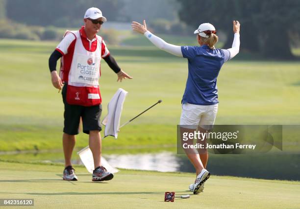 Stacy Lewis celebrates with her caddie Travis Wilson on the 18th green after her victory during the final round of the LPGA Cambia Portland Classic...