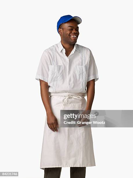 african man wearing cook's uniform - apron isolated stockfoto's en -beelden