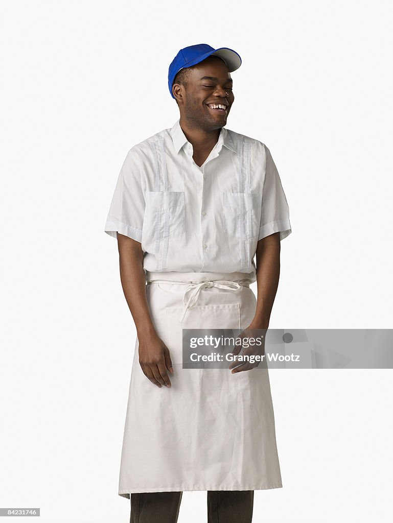 African man wearing cook's uniform