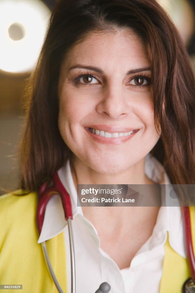 Confident mixed race doctor smiling