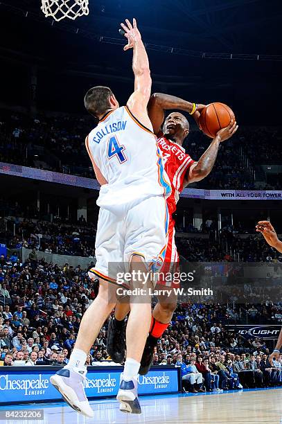 Von Wafer of the Houston Rockets goes to the basket against Nick Collison of the Oklahoma City Thunder at the Ford Center on January 9, 2009 in...