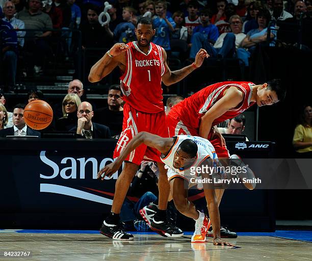 Kevin Durant of the Oklahoma City Thunder out hustles Tracy McGrady and Yao Ming of the Houston Rockets at the Ford Center on January 9, 2009 in...