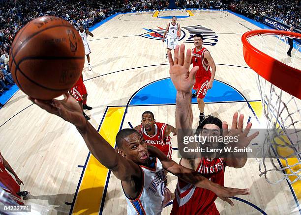 Russell Westbrook of the Oklahoma City Thunder goes to the basket against Luis Scola of the Houston Rockets at the Ford Center on January 9, 2009 in...