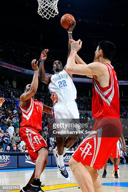 Jeff Green of the Oklahoma City Thunder goes to the basket against Tracy McGrady and Yao Ming of the Houston Rockets at the Ford Center on January 9,...