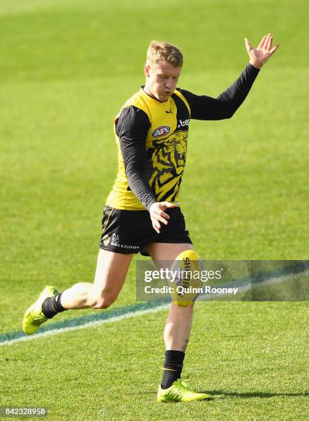 Josh Caddy of the Tigers kicks during a Richmond Tigers AFL training session at Punt Road Oval on September 4, 2017 in Melbourne, Australia.