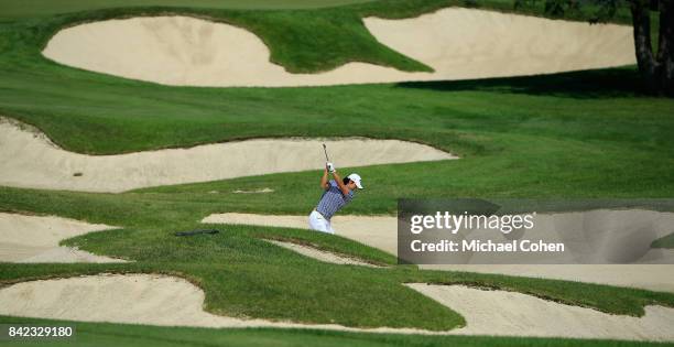 Ryo Ishikawa of Japan hits his second shot on the first hole from the fairway bunker complex during the fourth and final round of the Nationwide...