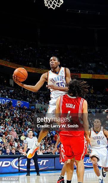 Kevin Durant of the Oklahoma City Thunder goes to the basket against Luis Scola of the Houston Rockets at the Ford Center on January 9, 2009 in...
