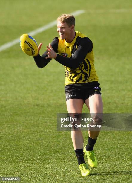 Josh Caddy of the Tigers marks during a Richmond Tigers AFL training session at Punt Road Oval on September 4, 2017 in Melbourne, Australia.