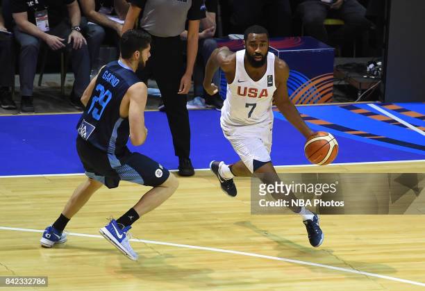 Reginald Williams II of United States fights for the ball with Patricio Garino of Argentina during the FIBA Americup final match between US and...
