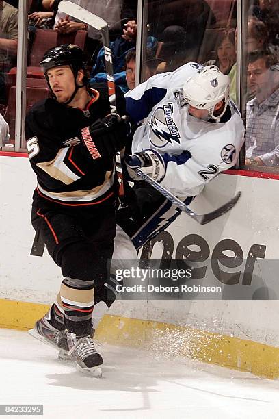 Vaclav Prospal of the Tampa Bay Lighting is checked into the boards Steve Montador of the Anaheim Ducks during the game on January 9, 2009 at Honda...