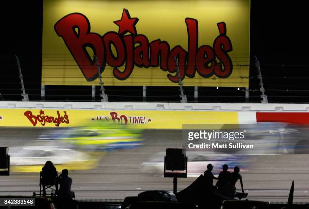 Cars race during the Monster Energy NASCAR Cup Series Bojangles' Southern 500 at Darlington Raceway on September 3, 2017 in Darlington, South...