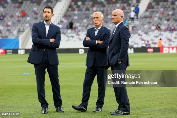 France's goalkeeper coach Franck Raviot head coach Didier Deschamps and assistant head coach Guy Stephan look on before the FIFA 2018 World Cup...