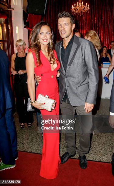 Former german soccer player Michael Ballack and his girlfriend Natacha Tannous attend the 'Nacht der Legenden' at Schmidts Tivoli on September 3,...