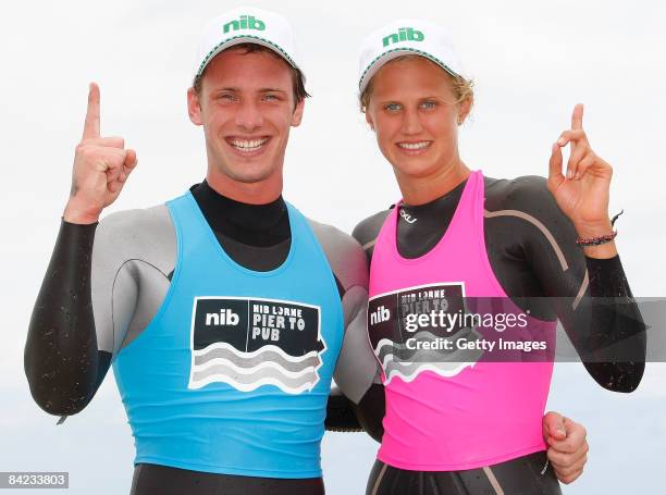 Nick Cordner and Harriet Brown pose after winning the Male and Female Open category during the Lorne Pier To Pub open water swim at Louttit Bay on...