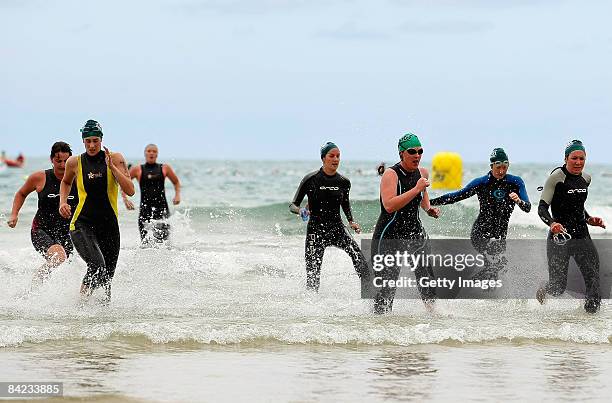 Competitors finish the race during the Lorne Pier To Pub open water swim at Louttit Bay on January 10, 2009 in Lorne, Australia.