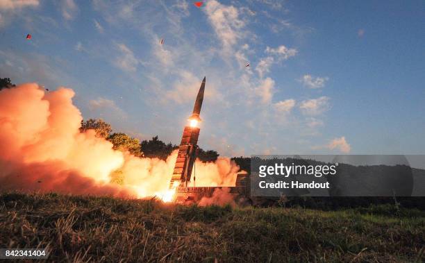 In this handout photo released by the South Korean Defense Ministry, South Korea's Hyunmu-2 ballistic missile is fired during an exercise aimed to...